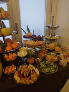 a table topped with lots of different types of fruit at Umberto House Catania in Catania