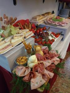 a buffet with lots of different types of food at Umberto House Catania in Catania