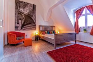 a bedroom with a bed and a staircase at Central Stylish Apartments in Budapest