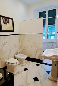 a bathroom with a toilet and a sink at DORA AUREA in Levanto