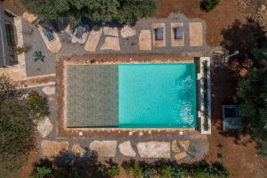 an overhead view of a swimming pool at Trulli cicale e olive in Ceglie Messapica