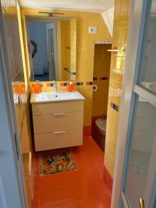 a bathroom with a sink and a mirror at Marechiaro House in Naples