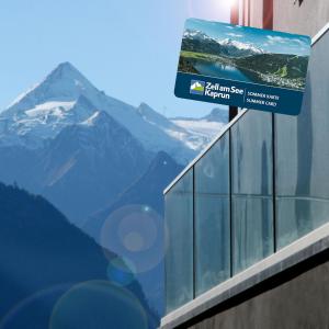 a window with a view of a mountain at Aparthotel Zell am See (Contactless Check-In) in Zell am See