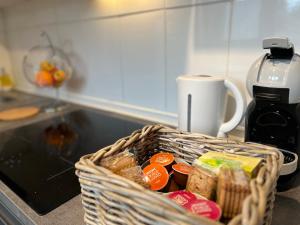 a basket of food sitting on a kitchen counter at La Belle Endormie - Louez L'Esprit Libre ! in Champs-sur-Marne