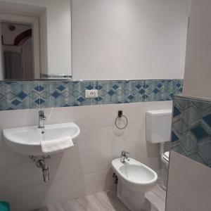 a bathroom with a sink and a toilet at Casa Isabella De Luxe Studio in Monterosso al Mare
