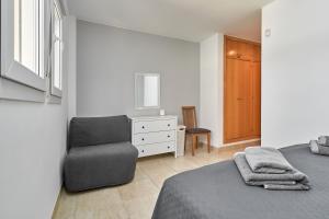 Ένα ή περισσότερα κρεβάτια σε δωμάτιο στο Apartamento Vistamar +23 φωτογραφίες