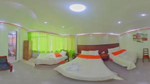 Postel nebo postele na pokoji v ubytování Hostal La Siesta