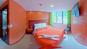 Postel nebo postele na pokoji v ubytování Hostal La Siesta