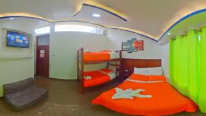 Postel nebo postele na pokoji v ubytování Hostal La Siesta
