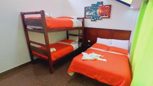 Postel nebo postele na pokoji v ubytování Hostal La Siesta