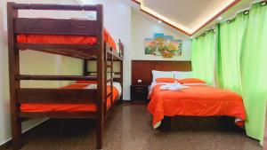 Postel nebo postele na pokoji v ubytování Hostal La Siesta