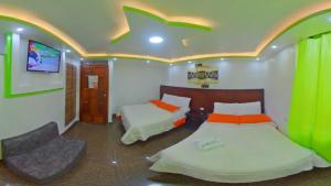 Postel nebo postele na pokoji v ubytování Hostal La Siesta