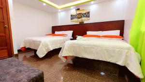 Postel nebo postele na pokoji v ubytování Hostal La Siesta