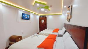 Postel nebo postele na pokoji v ubytování Hostal La Siesta