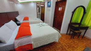Postel nebo postele na pokoji v ubytování Hostal La Siesta