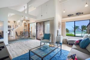 a living room with a view of the ocean at Sealodge Villa H5 in Princeville
