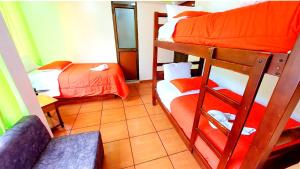 Postel nebo postele na pokoji v ubytování Hostal La Siesta