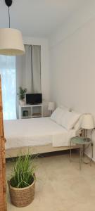 Postel nebo postele na pokoji v ubytování Neaktion Apartments