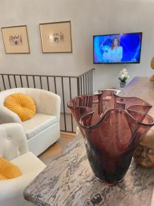 A television and/or entertainment centre at Accademia Dream