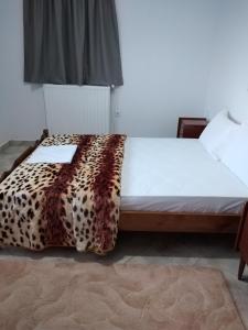 Postel nebo postele na pokoji v ubytování Kimi apartments