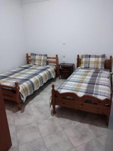 Postel nebo postele na pokoji v ubytování Kimi apartments