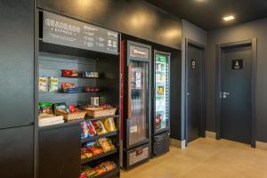 a grocery store aisle with a refrigerator and food at LIV - Apartamento 904 in Porto Alegre