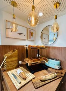 a bakery with bread and pastries on a counter at Residhome Quai d’Ivry in Ivry-sur-Seine