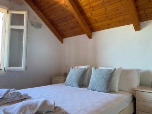 Postel nebo postele na pokoji v ubytování Pandora Villa