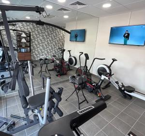 a gym with a bunch of exercise equipment in a room at Residhome Quai d’Ivry in Ivry-sur-Seine