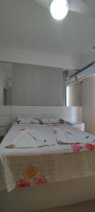 Voodi või voodid majutusasutuse Apartamento Balneário Camboriu toas