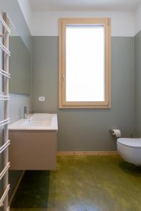 a bathroom with a sink and a window at terracielo. in Faenza +15 photos