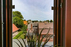a view of a city from a window at Ferienzimmeranlage Deutsches Haus Deutsches Haus App 35 in Wustrow