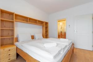 Posteľ alebo postele v izbe v ubytovaní Együtt a Család II Apartman By BLTN