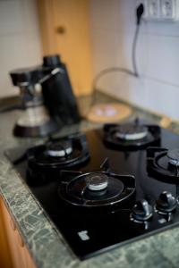 Kuchyňa alebo kuchynka v ubytovaní Együtt a Család II Apartman By BLTN
