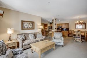 a living room with a couch and a table at The Springs Condominiums by Keystone Resort in Keystone