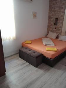 a bedroom with a bed and a couch in it at Mario Complex in Melnik