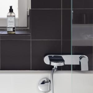a bottle of soap sitting on top of a bathroom sink at Maison Cimes in Les Orres +79 photos