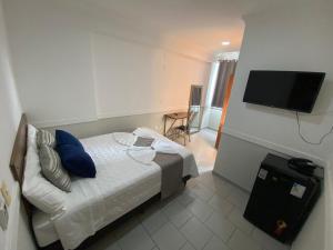 TV a/nebo společenská místnost v ubytování Hotel Caiçara