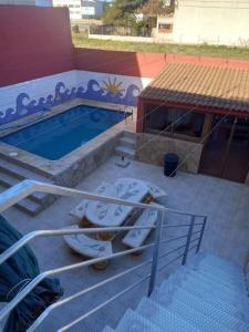 two toilets sitting next to a swimming pool at casa con piscina privada in Vinarós