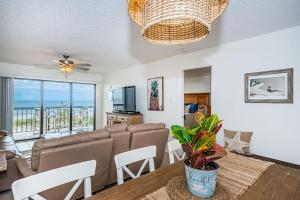 a living room with a couch and a table at Sandcastle North Unit #403 in Clearwater Beach