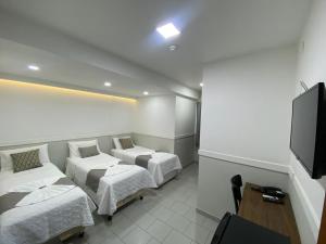 Postel nebo postele na pokoji v ubytování Hotel Caiçara