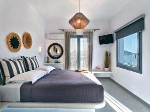 Postel nebo postele na pokoji v ubytování Ariti Seaside Residence + 36 fotografií