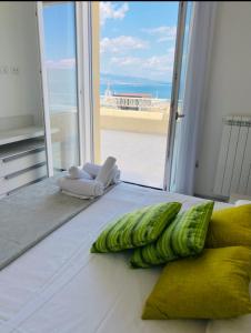 a room with a bed with a view of the ocean at Suite vista mare in Gaeta