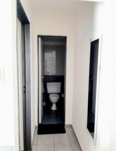 a bathroom with a white toilet in a room at BV ILLIA TERMINAL DE OMNIBUS in Cordoba