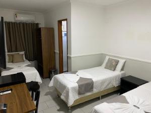 Postel nebo postele na pokoji v ubytování Hotel Caiçara