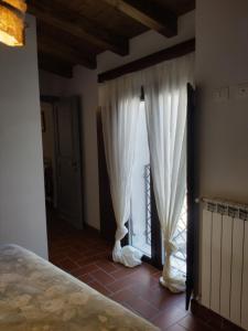 Postel nebo postele na pokoji v ubytování La Locanda n'gima all' ara