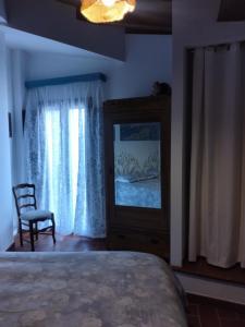 Postel nebo postele na pokoji v ubytování La Locanda n'gima all' ara