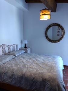 Postel nebo postele na pokoji v ubytování La Locanda n'gima all' ara + 14 fotografií