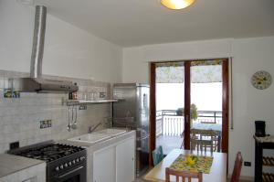 a kitchen with a sink and a stove top oven at Il lago e la collina in Stresa