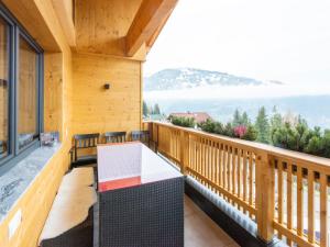 a balcony with a table and a view of the mountains at Haus Heimat - Alpenrose 